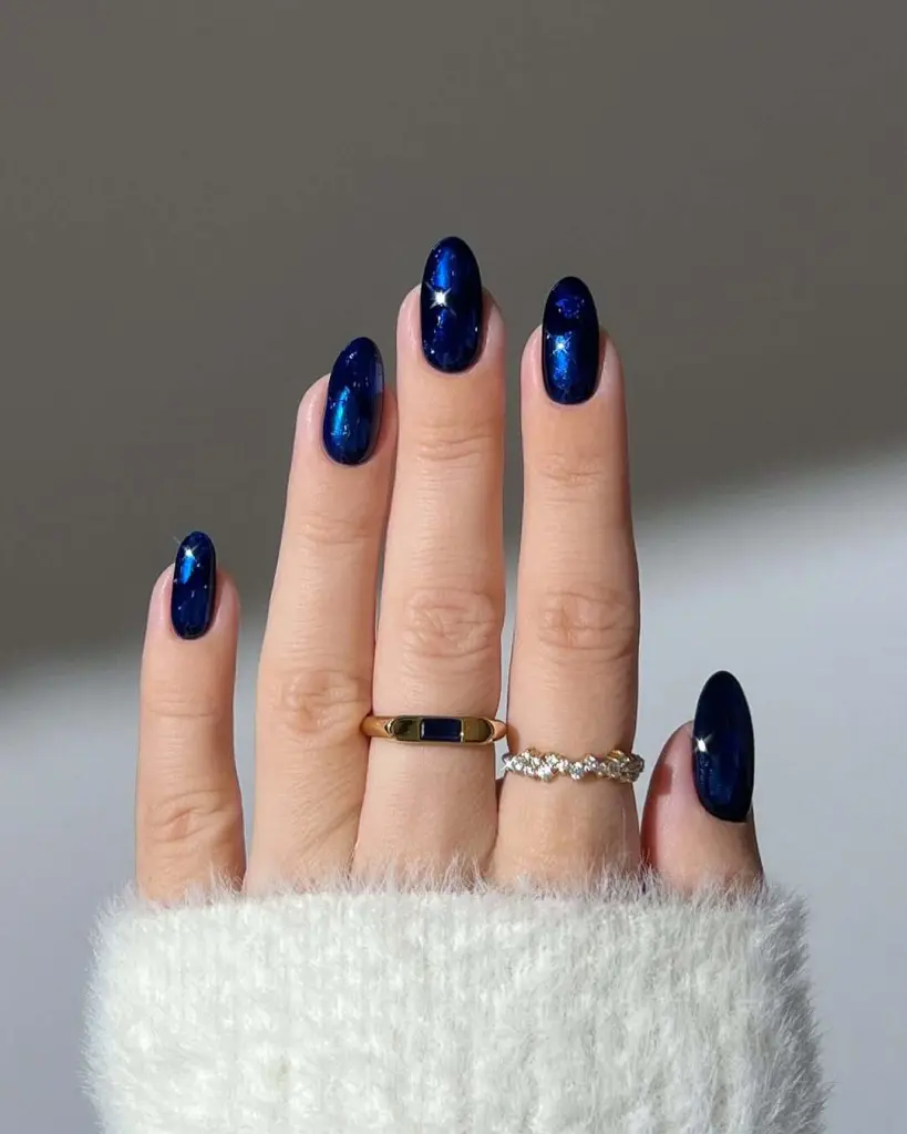sparkling midnight blue oval nails for new years 