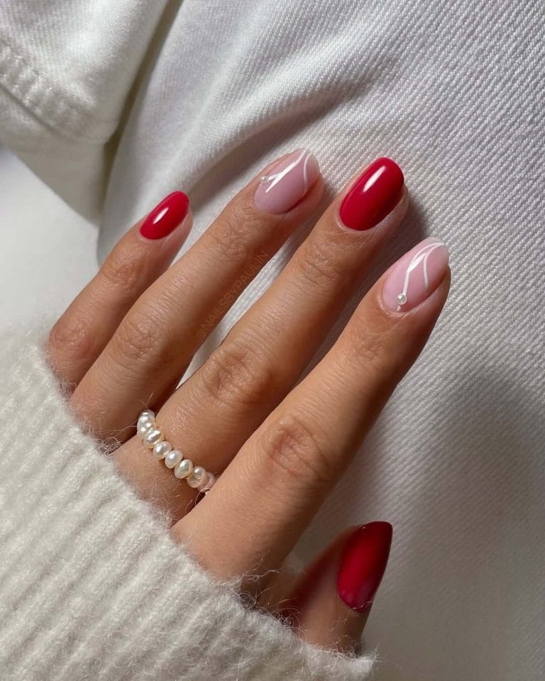 Red and nude manicure with white abstract line art and pearl details