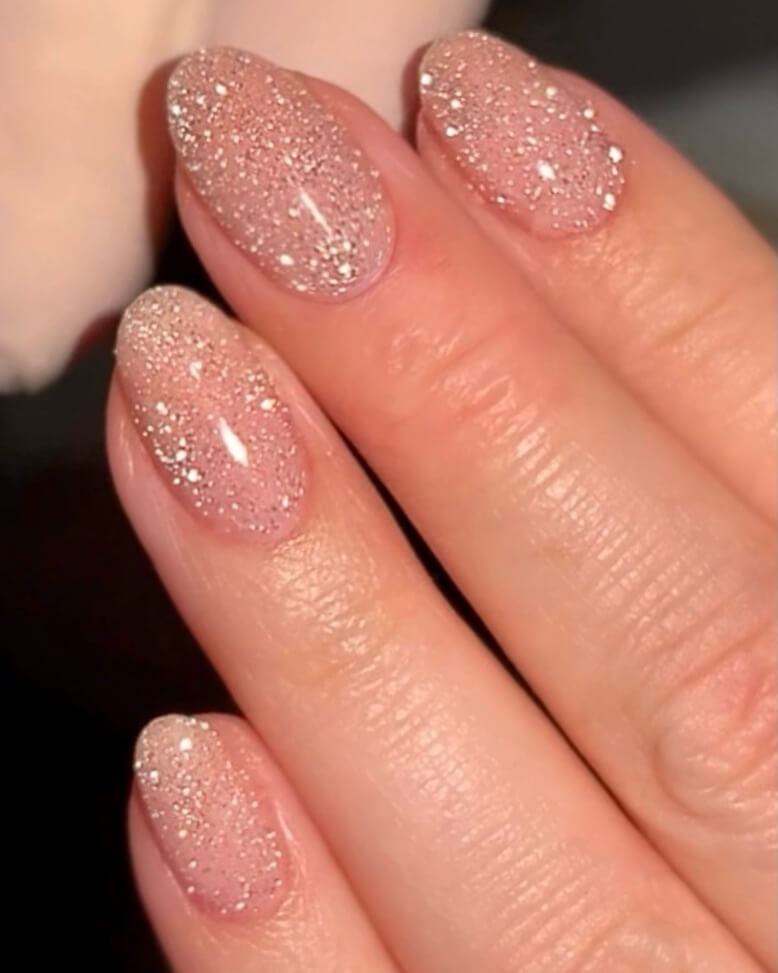 Rose gold glitter nails on almond shaped nails