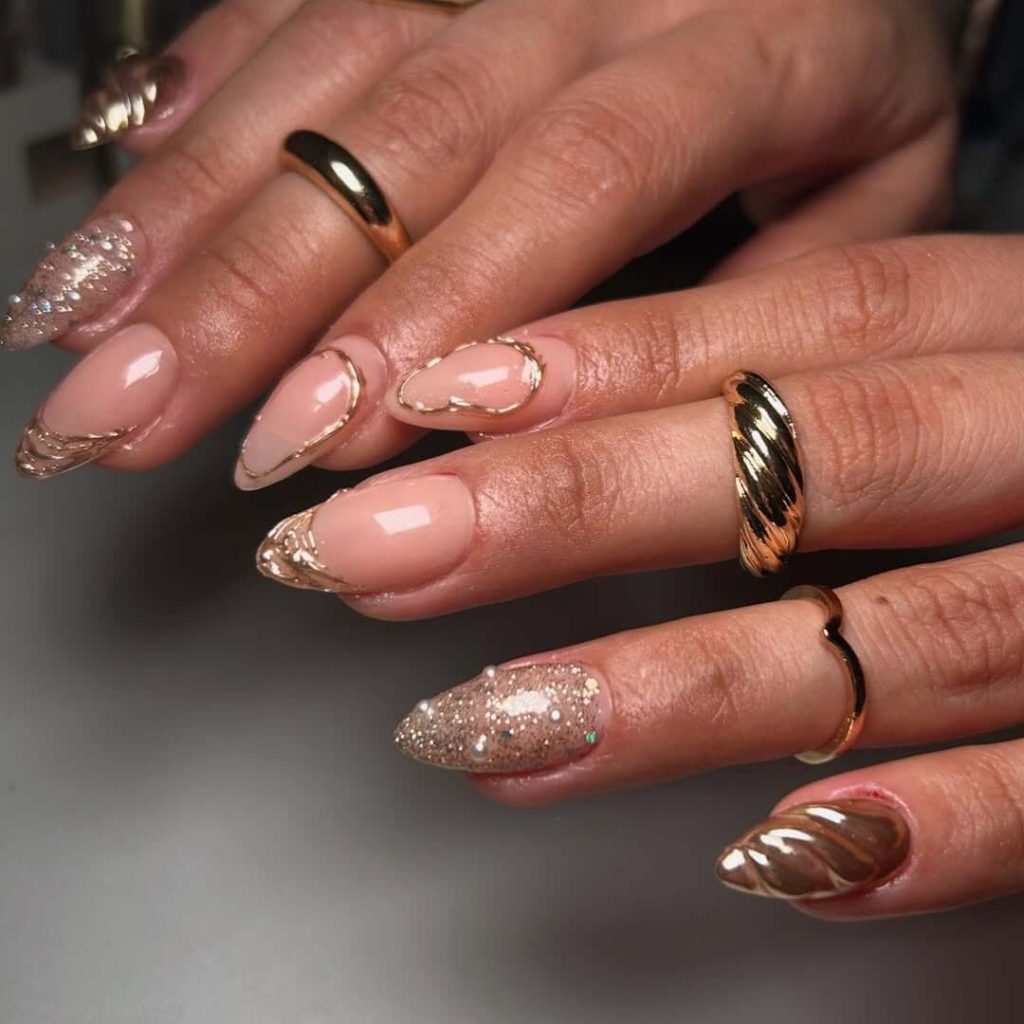 Nude almond nail with metallic gold accents designs for new years