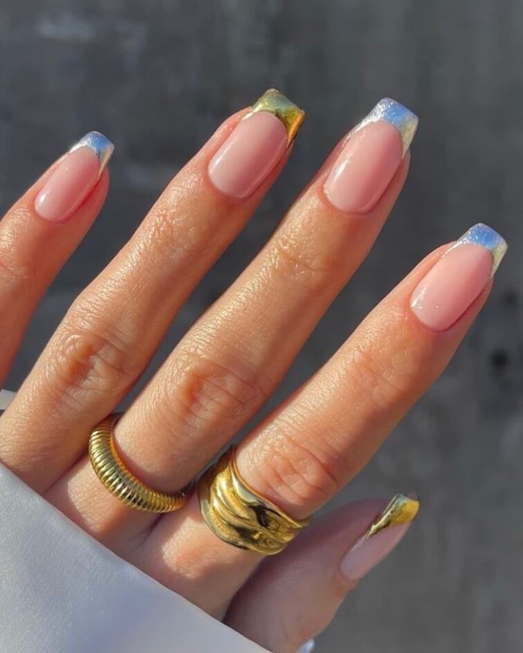Chrome holographic French tips on natural pink base new years nails
