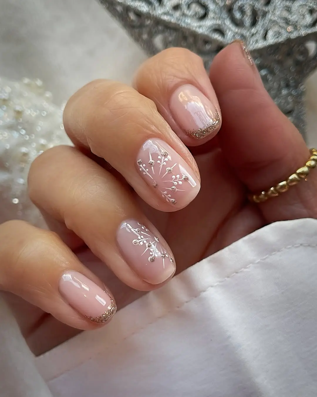 white florals and gold sparks nude nails