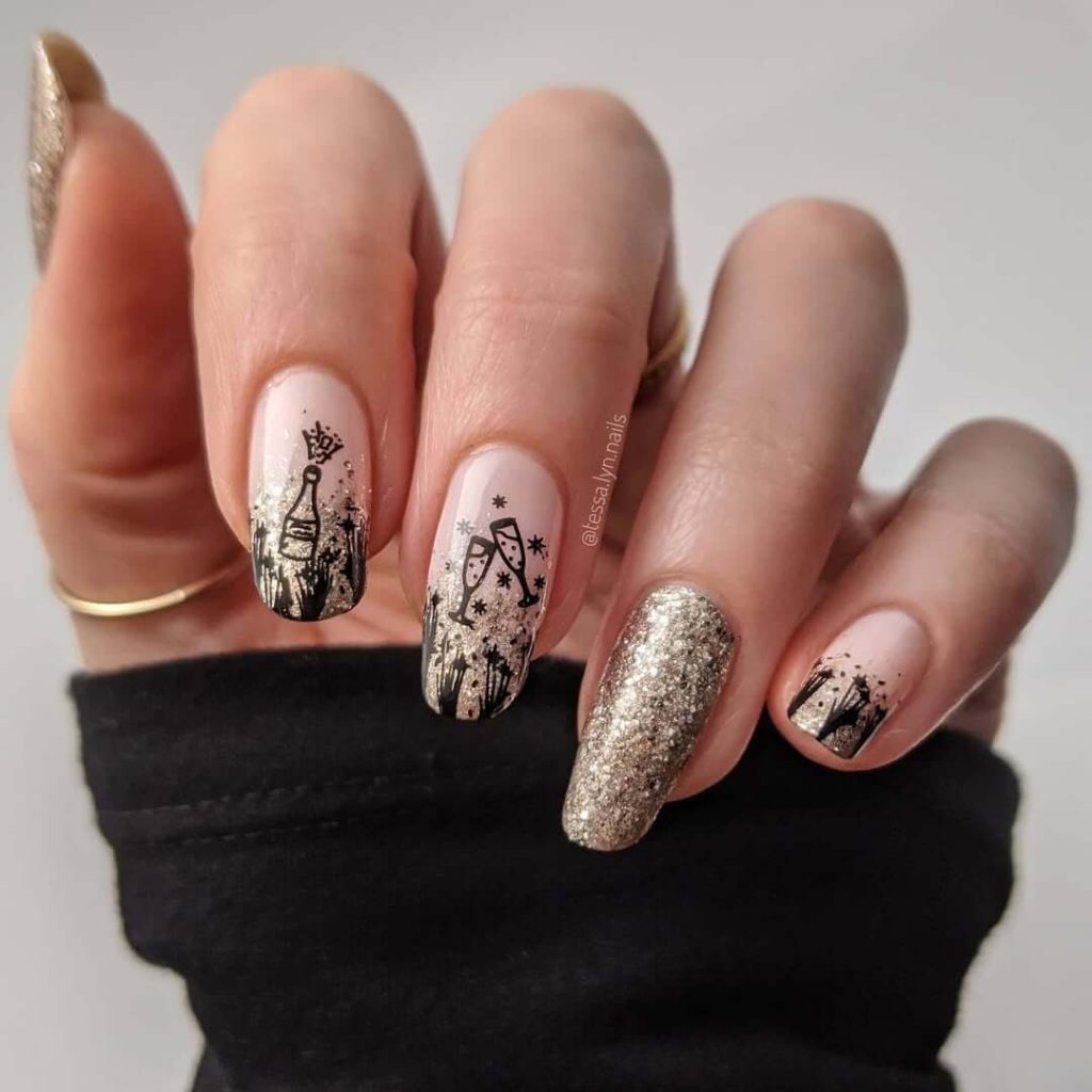 Champagne bottle and glass nail art on nude base with gold glitter accent nail for new years