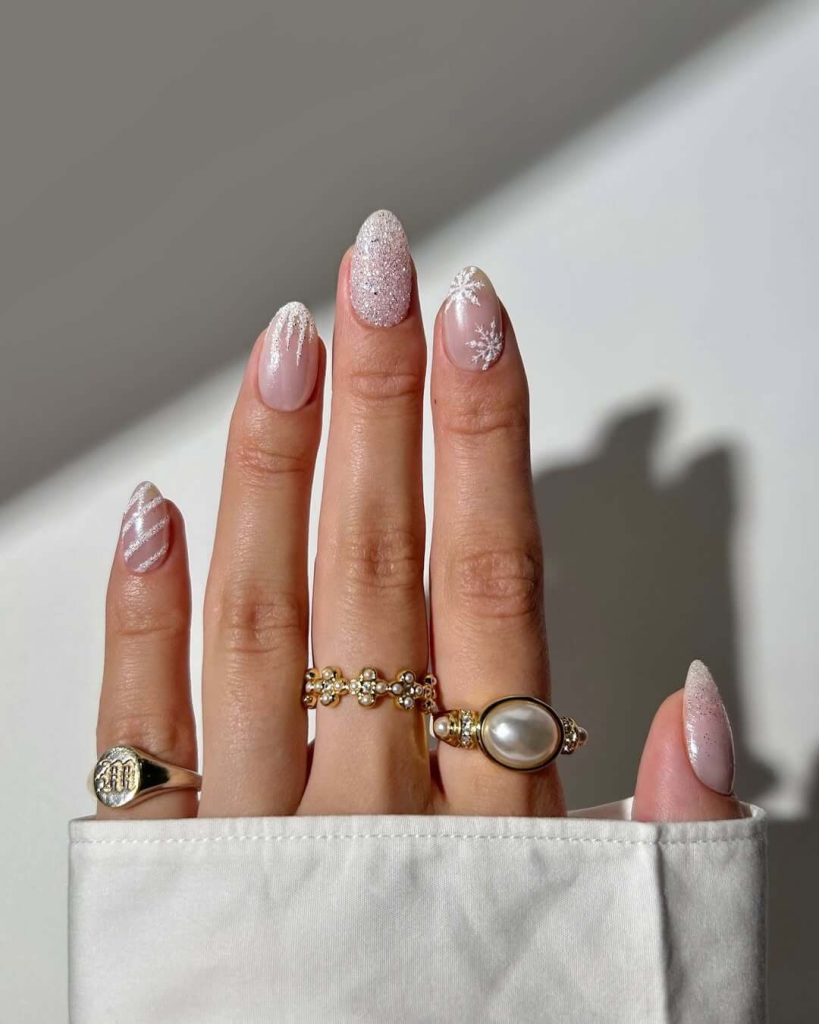 Frosted winter nails with white swirls and full glitter accent nail