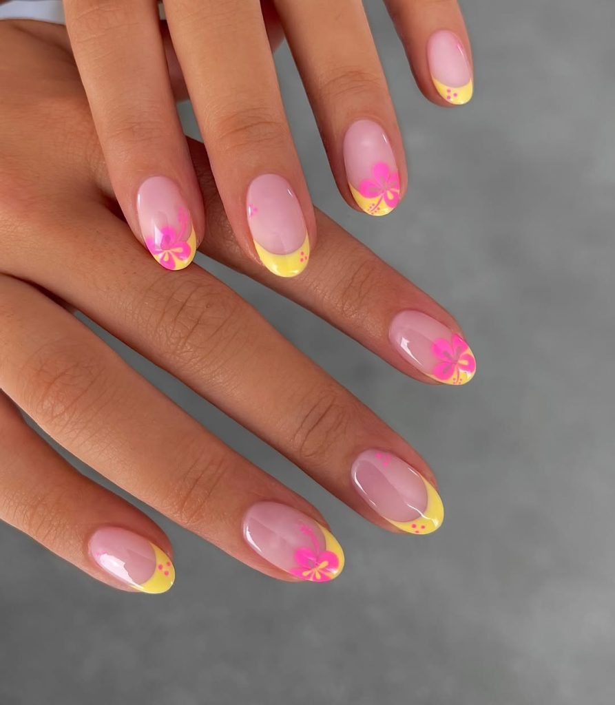 Sheer Pink spring nails with yellow French tips and hot pink hibiscus flower accents