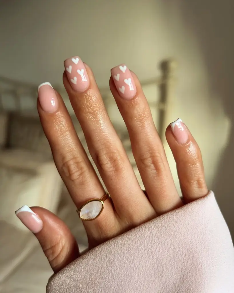 French tip nails with white floating hearts