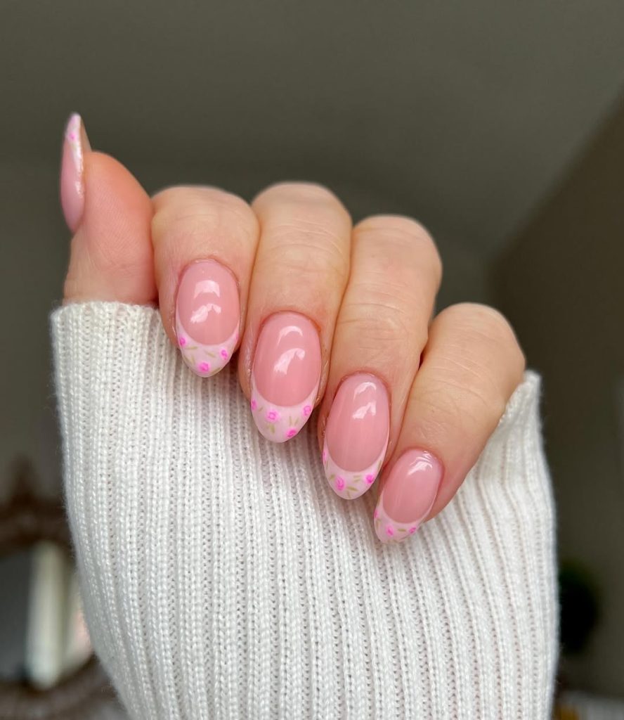 Pink spring  nails with pink French tips and pink rosebud accents
