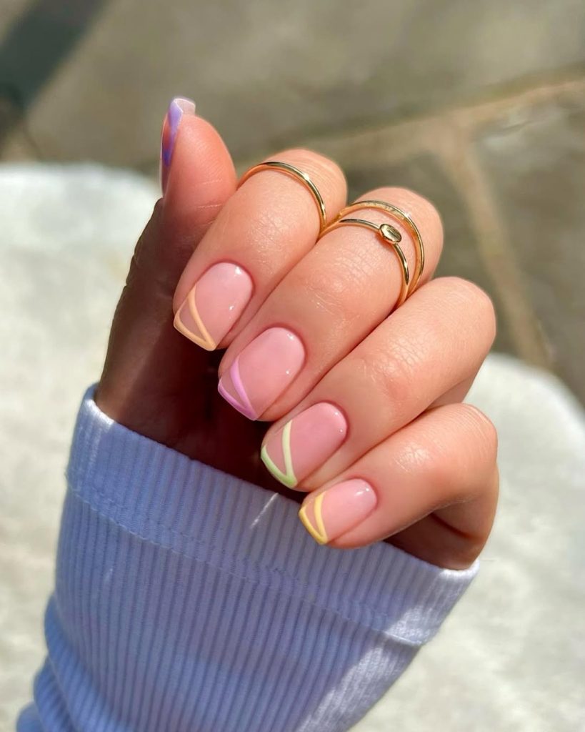 Elegant square nails with pink base and multicolor pastel diagonal line details