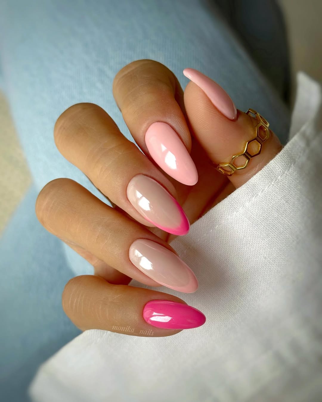 Long almond nails with pink gradient mix: baby pink base, hot pink French tips and full hot pink accent nail