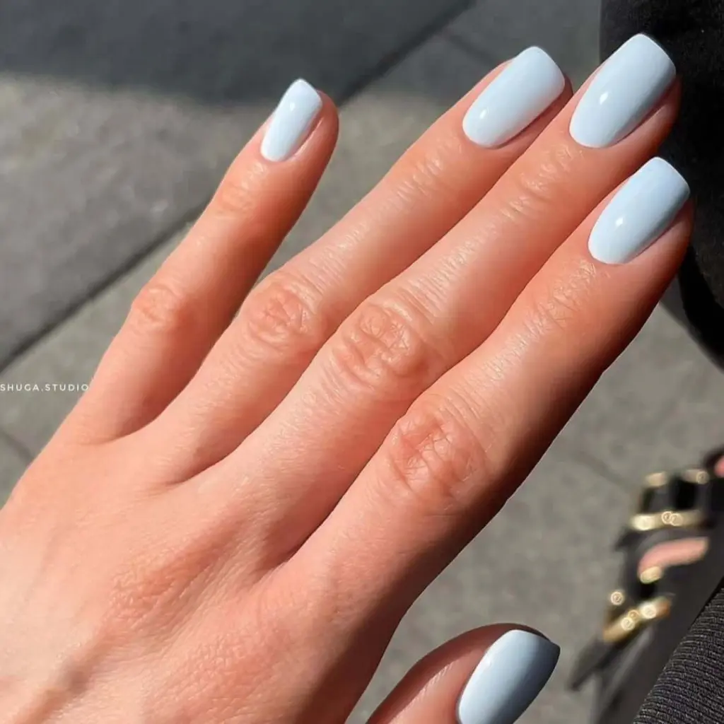 Light blue squoval nails with glossy finish