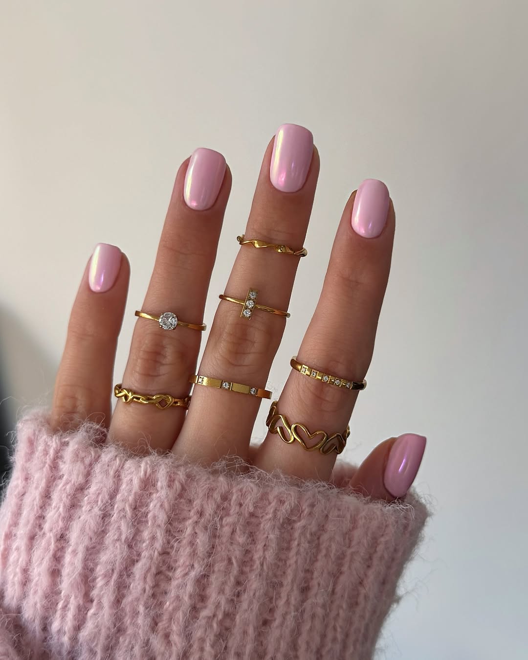 Short square nails with chrome pink polish finish
