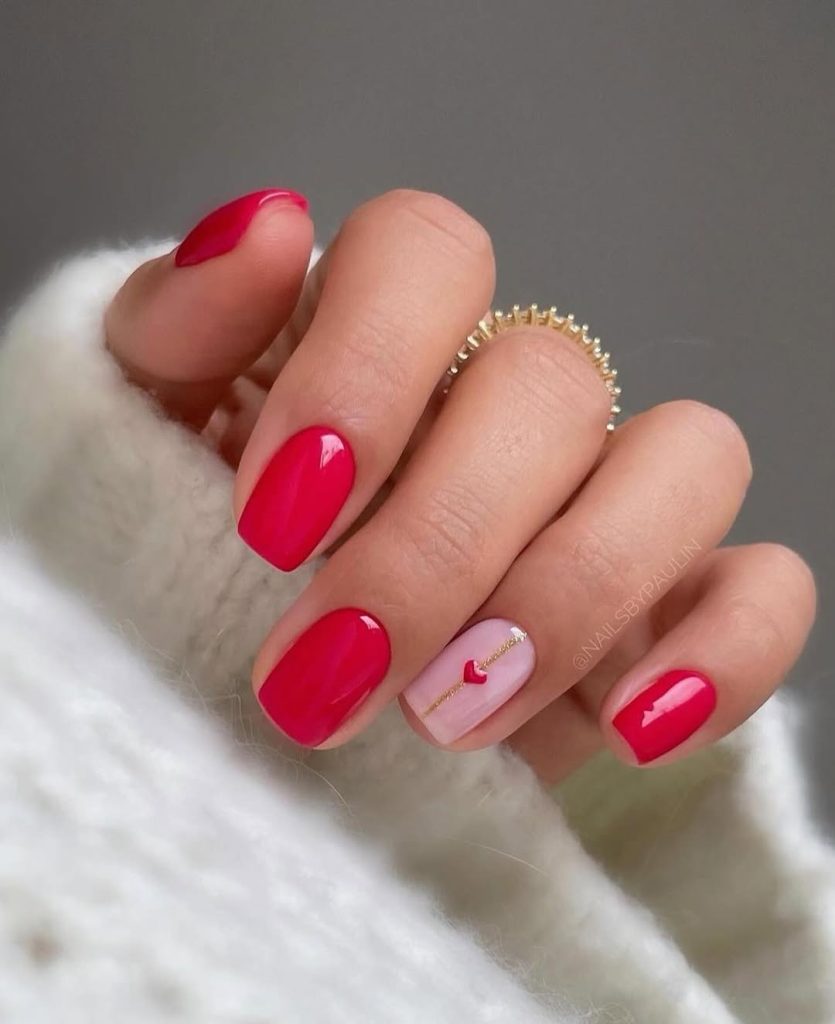 Red nails with pink heart and line accent nail
