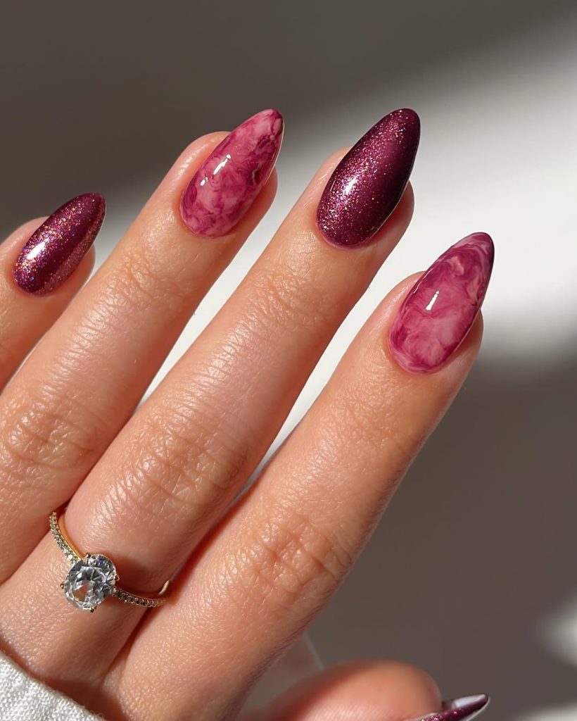 Pink marble and plum glitter almond nails