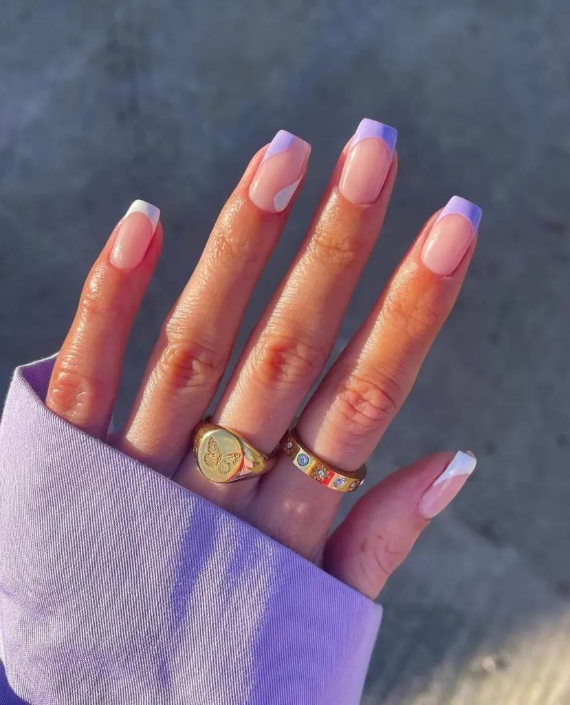 Sheer pink nails with purple French tips
