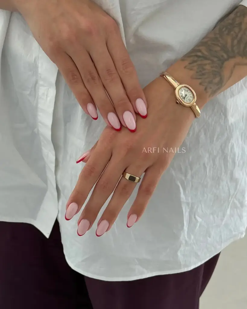 Long almond nails with white base and red french tips