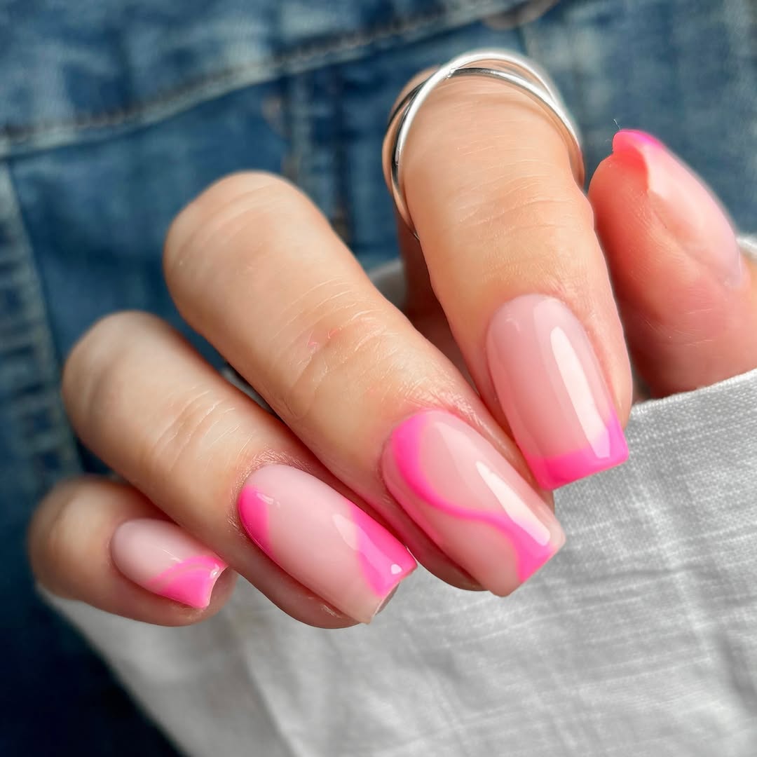 square nails with light pink base and mixed hot pink details: French tip, curved lines, and solid pink