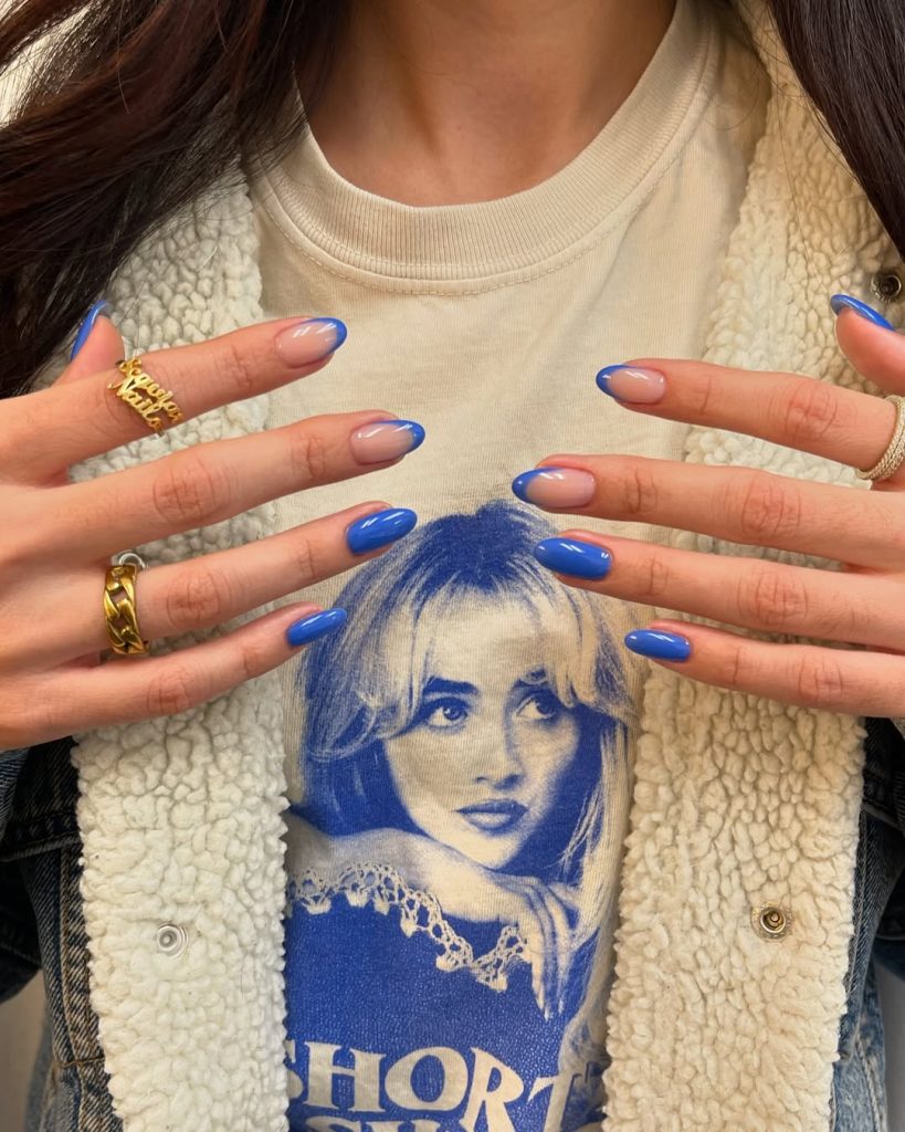 Nude and royal blue nails with blue French tips
