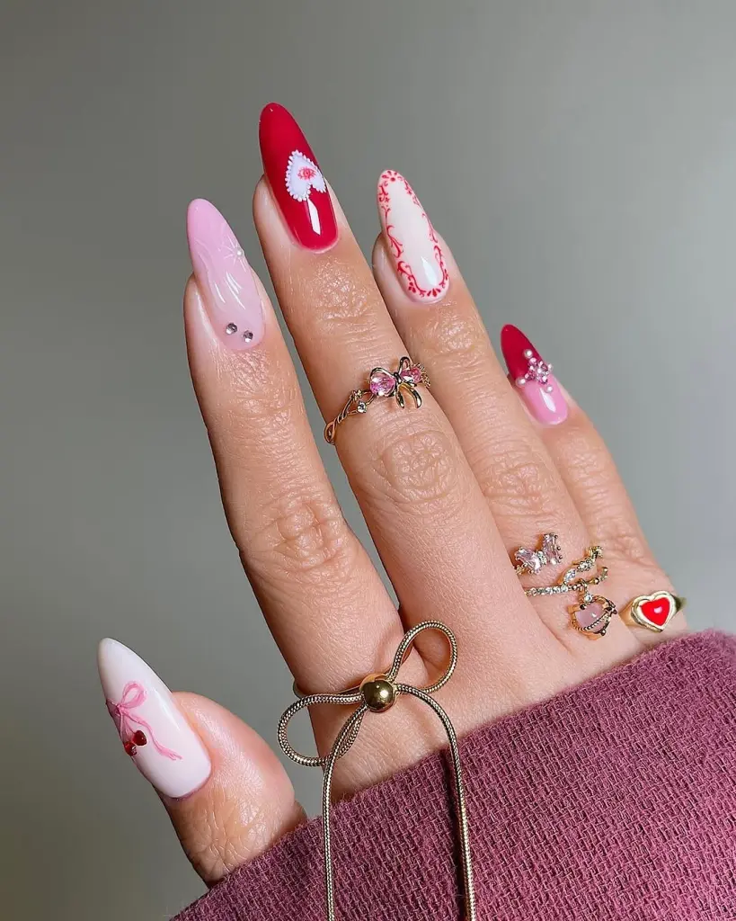 White and red mixed nails with heart designs and crystal accents Valentine day nails
