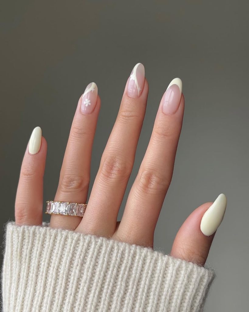 Nude almond nails with off-white accent nails
