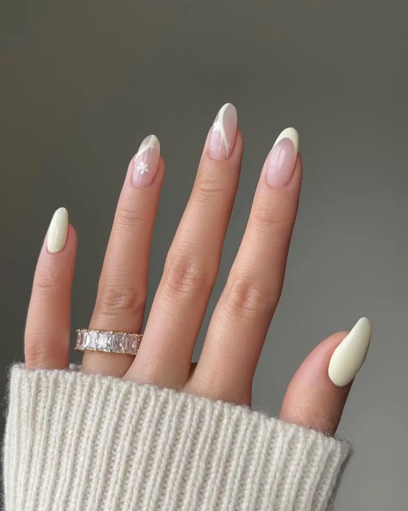 Nude almond nails with off-white accent nails
