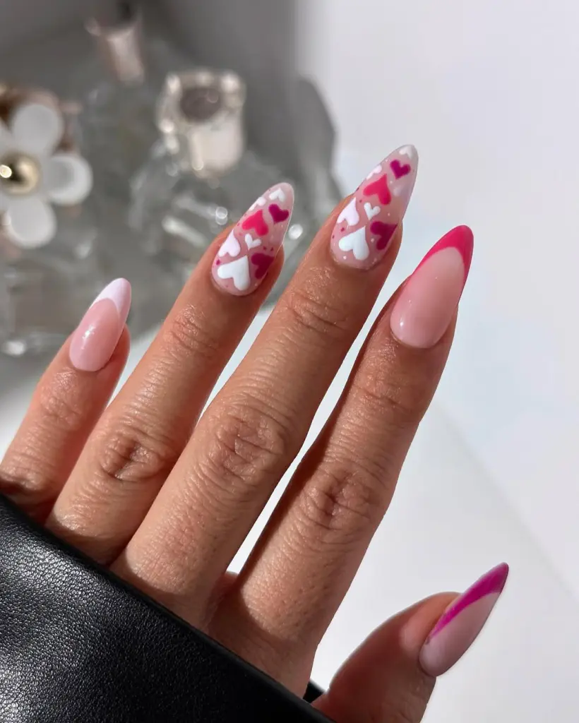 Pink and white nails with cascading heart design and magenta tips