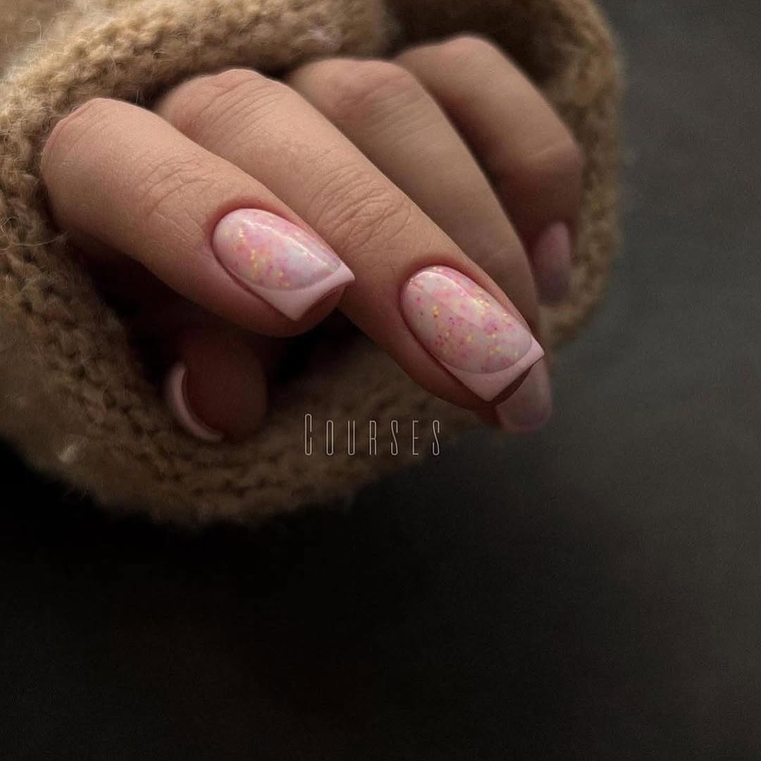 square nails with baby pink French tips and pink glitter details
