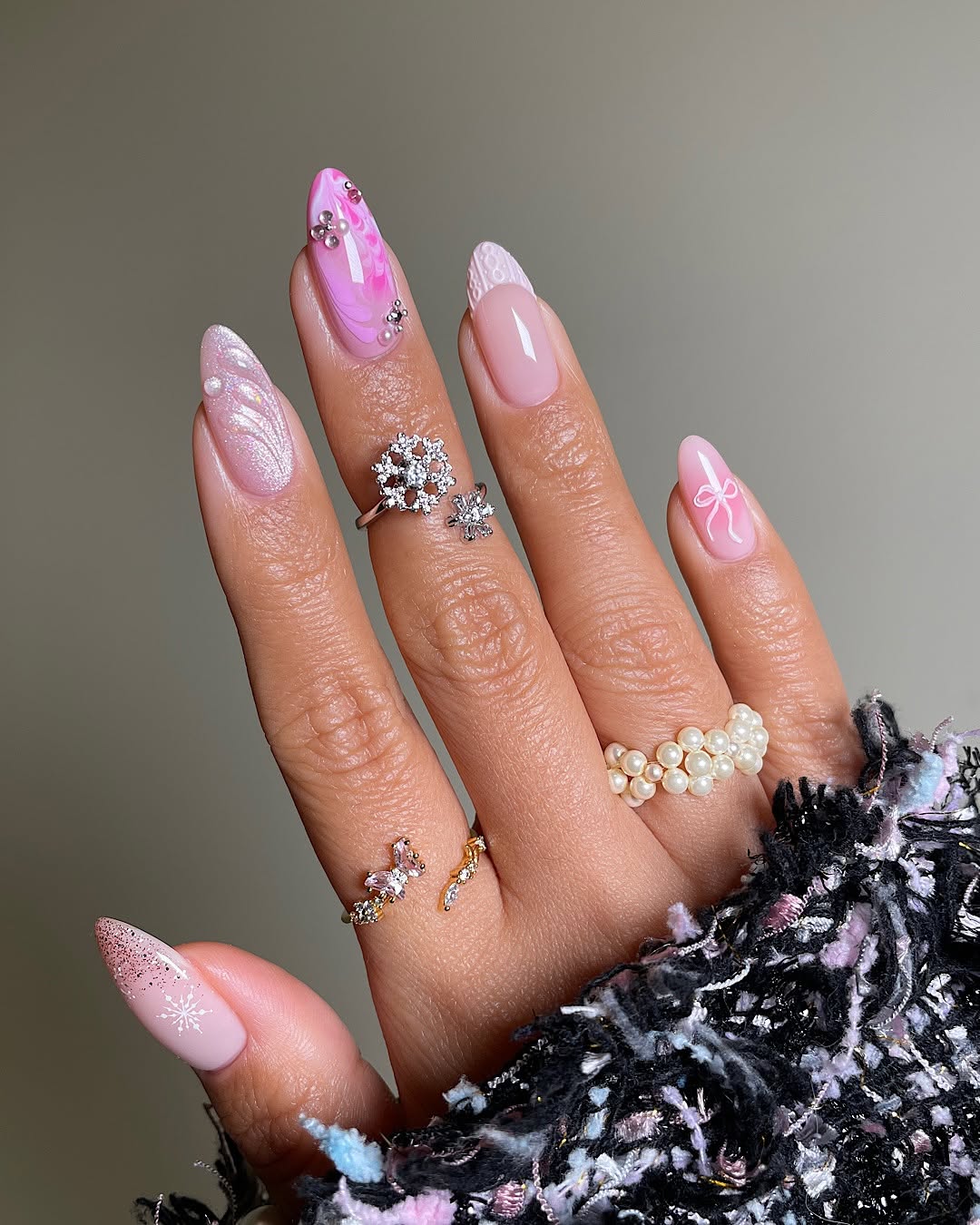 Long almond nails with mixed pink winter design and white details