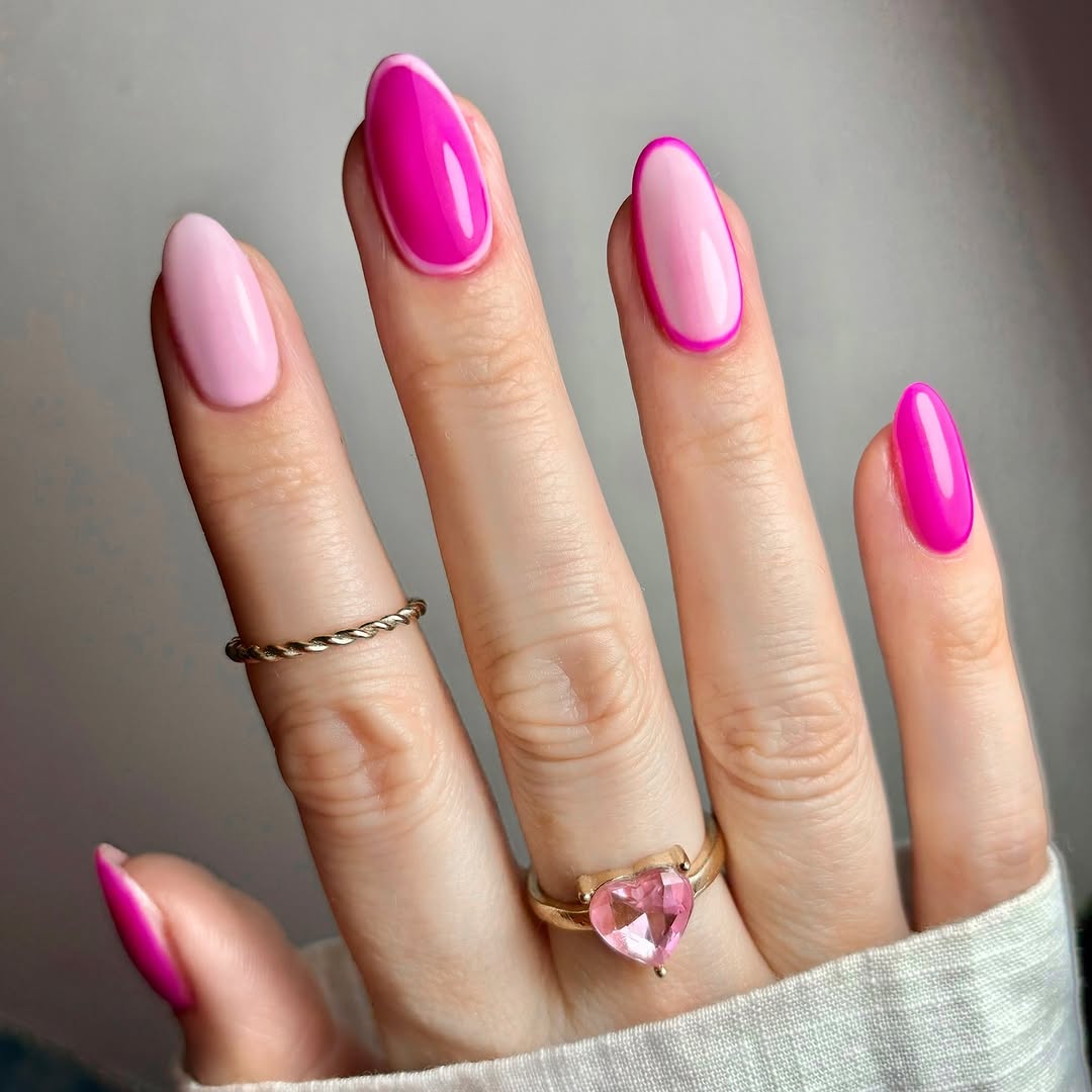 Long  almond nails with light pink base hot pink polish and pink line art
