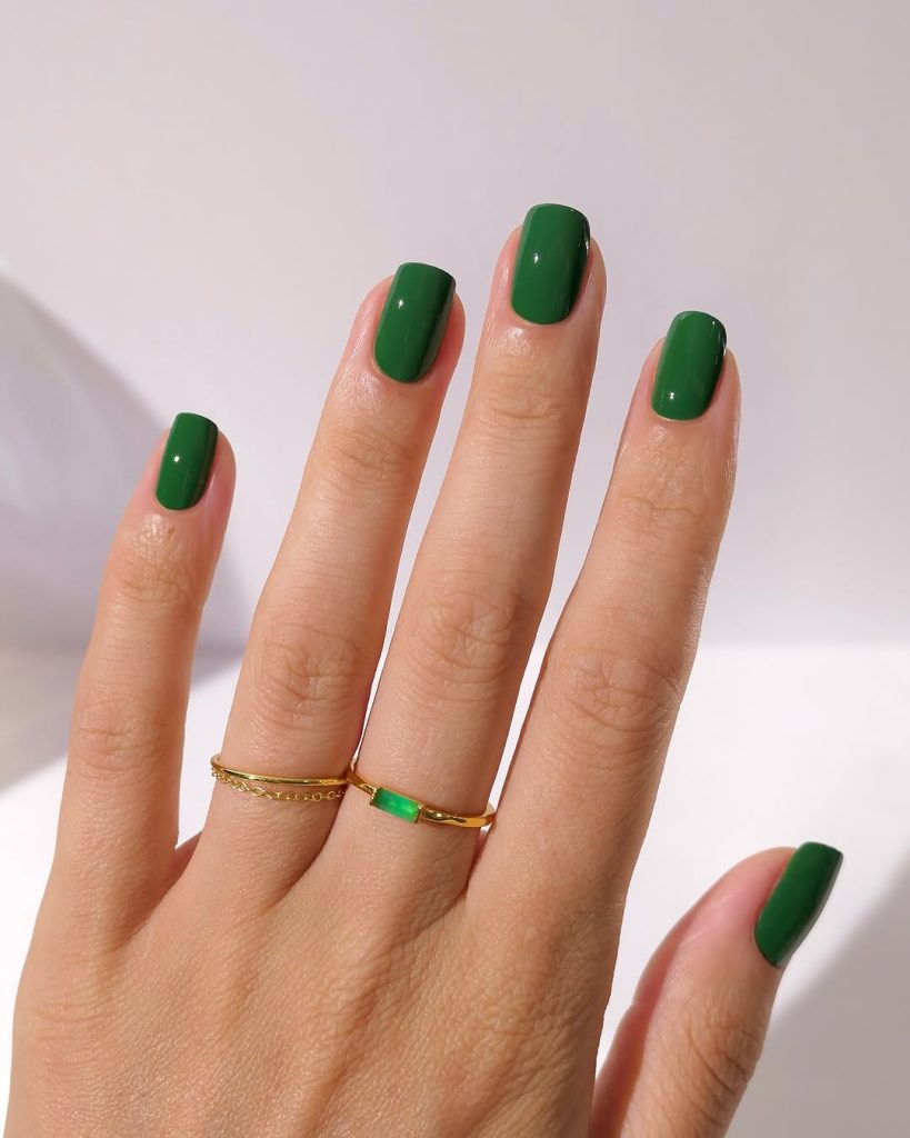 Short square nails with solid glossy forest green polish