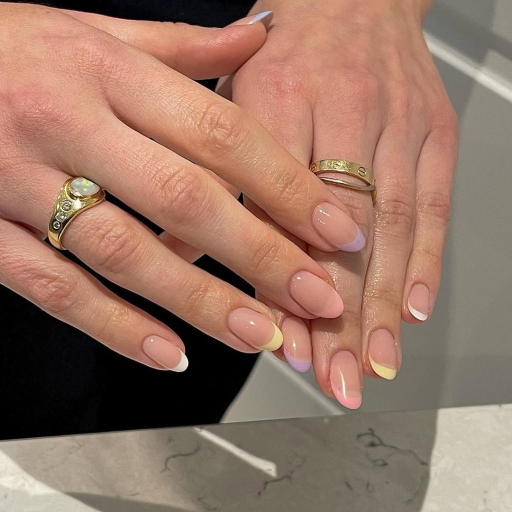 Sheer pink nails with pastel french tips