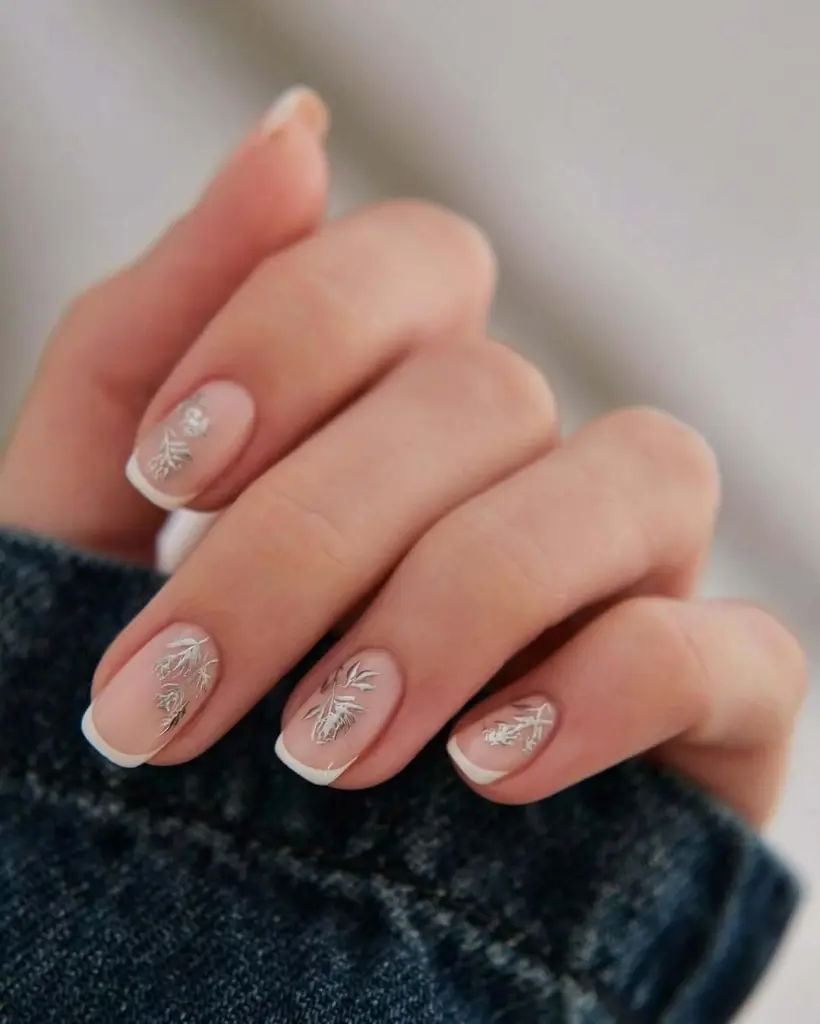 French manicure with silver branch nail art details