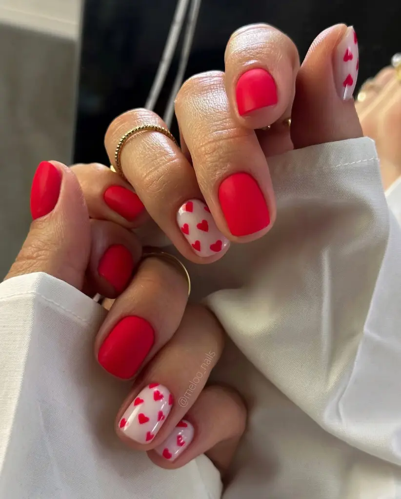 Short cream and red nails with red heart designs