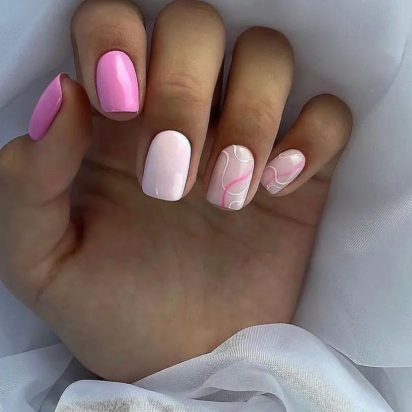 Short square nails with pink skittle design and pink swirl art