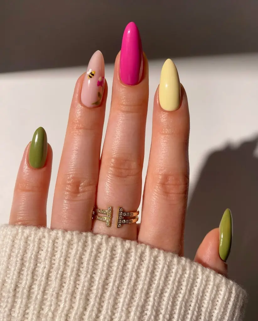 Bold spring hues steal the show with this skittle mani. Sheer nude floral accent adds elegance while hot pink, lemon yellow, and olive tones bring straight summer energy to your March lineup.