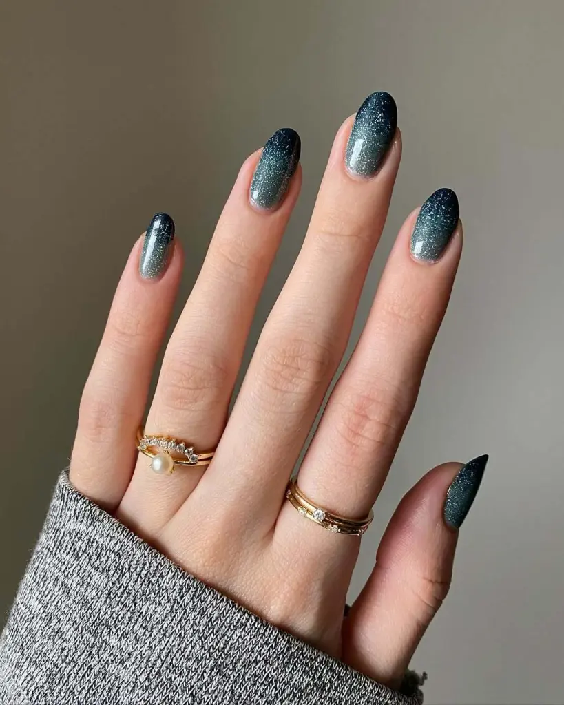Turquoise to navy blue ombre nails with glitter gradient