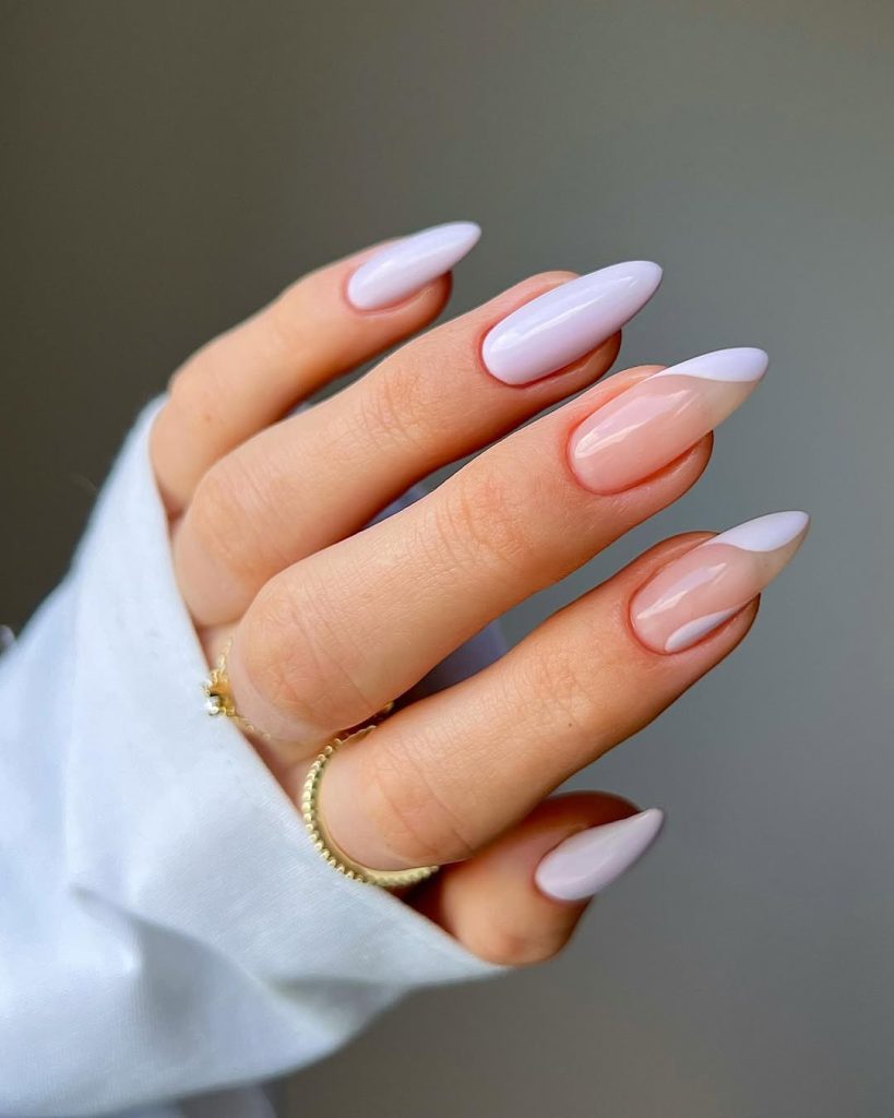 Classy long almond nails painted in soft lilac polish