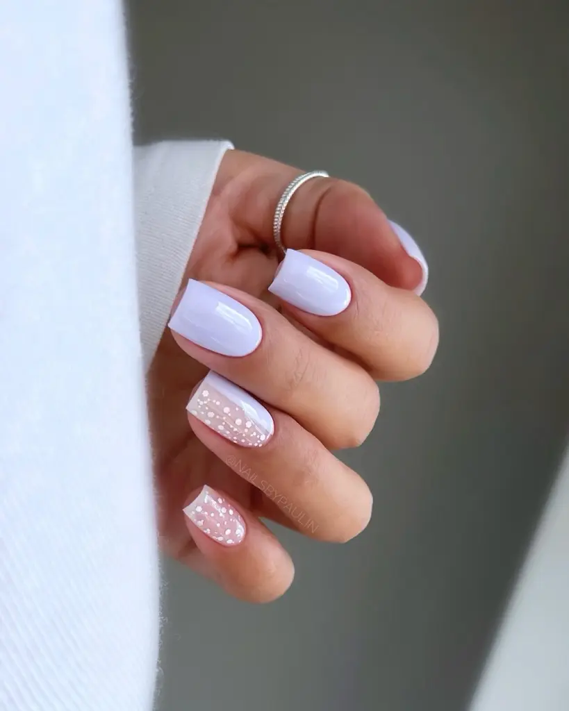 Short square nails with baby blue polish and white shimmer accent nails for spring