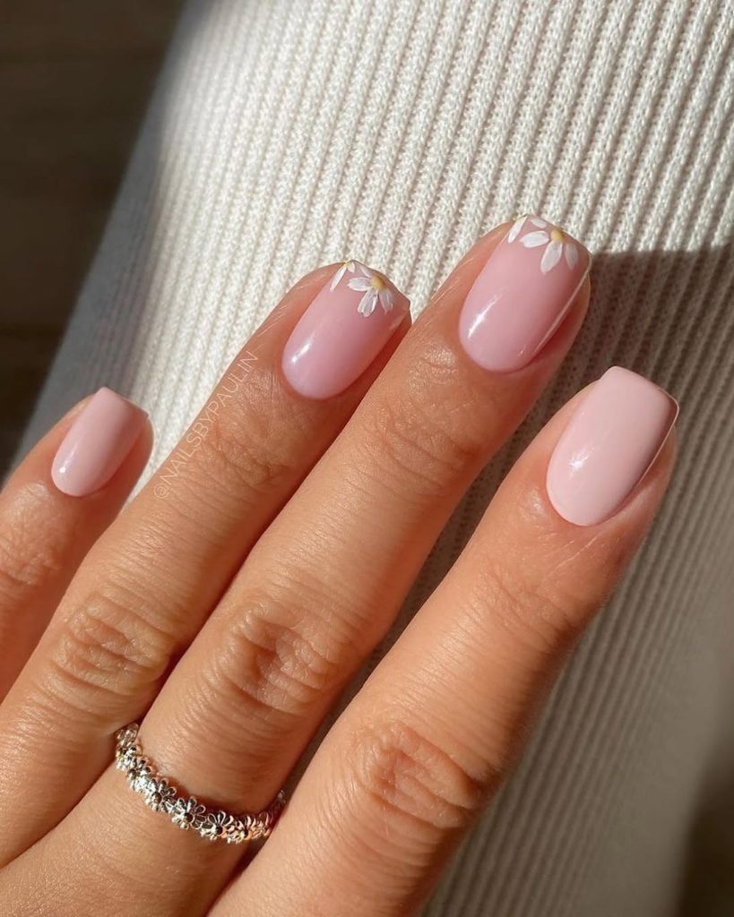 classy spring square nails with nude pink base and tiny white daisy flower details
