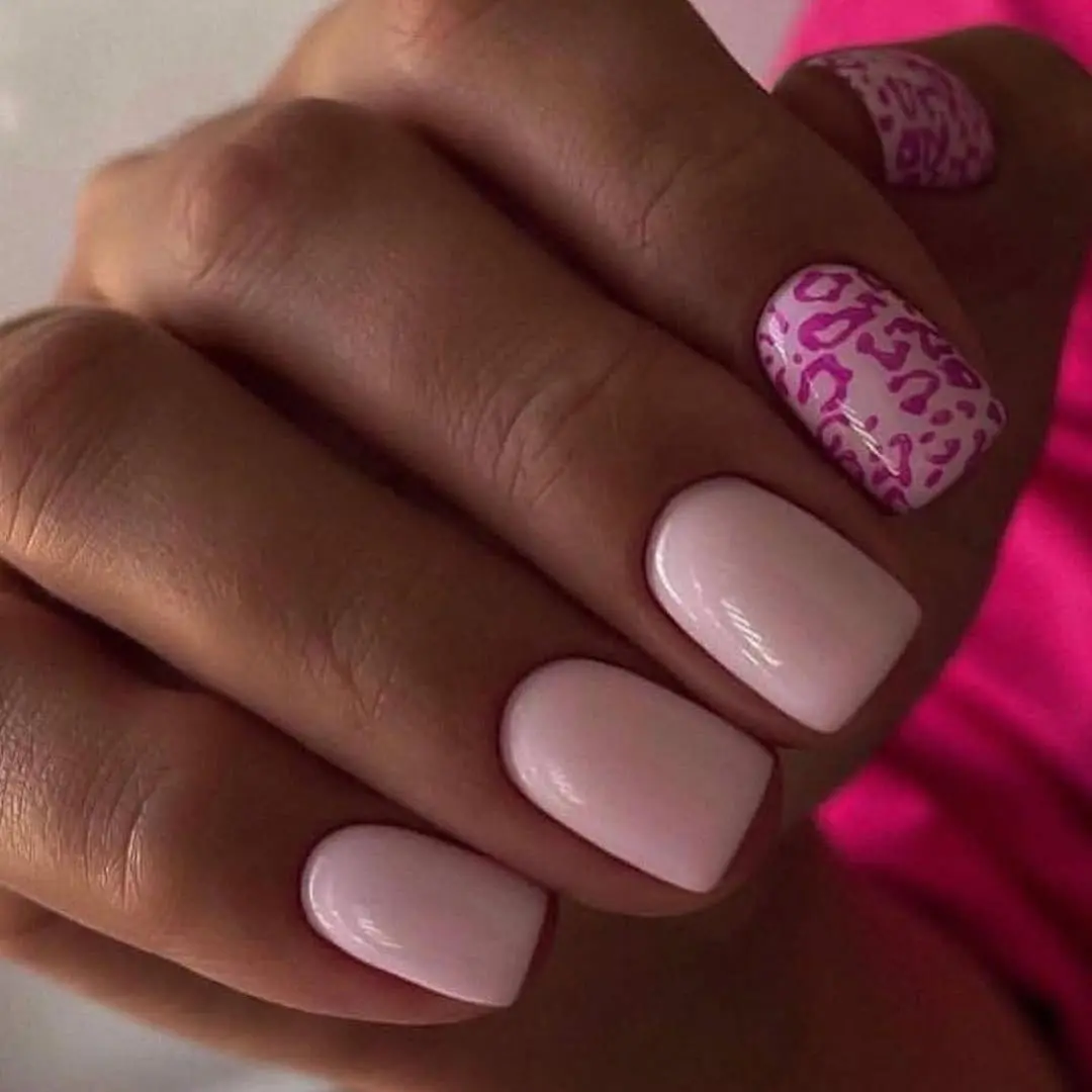 Short square pink nails with baby pink base and pink leopard print accent nail