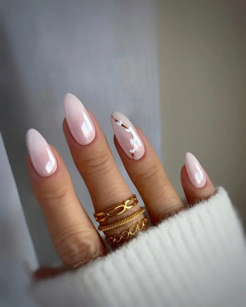 Pink glazed chrome nails with heart design and almond shape