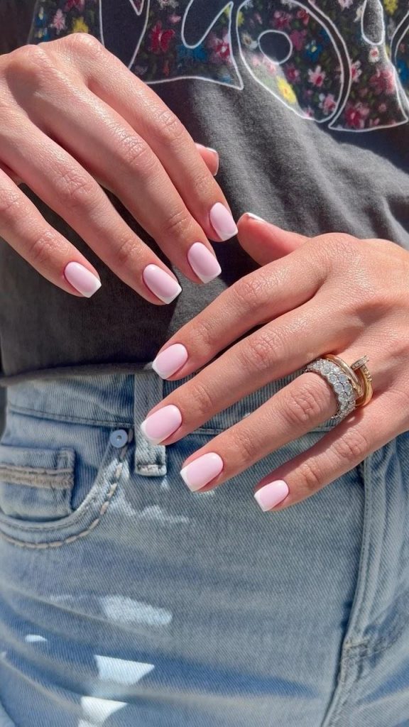 Short square nails with translucent milky base and clean white French tips
