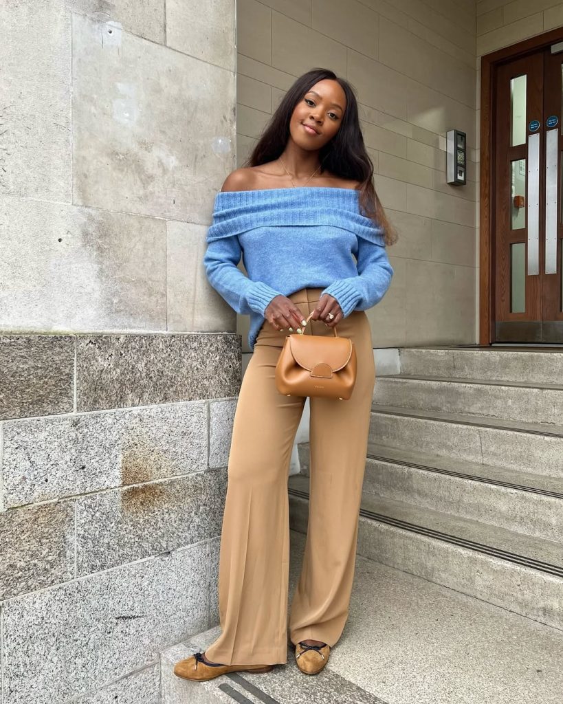 Elegant spring outfit with blue off shoulder sweater, camel wide leg trousers, tan ballet flats and mini leather bag