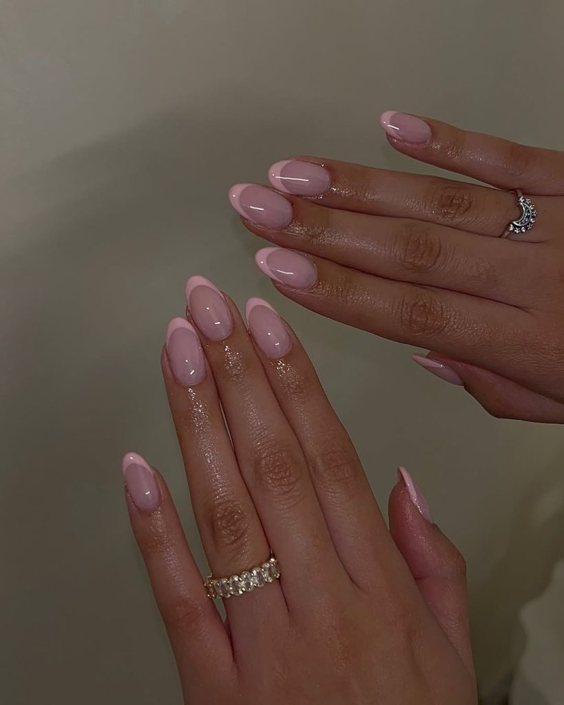Classy almond nails with light pink base and darker pink French tips
