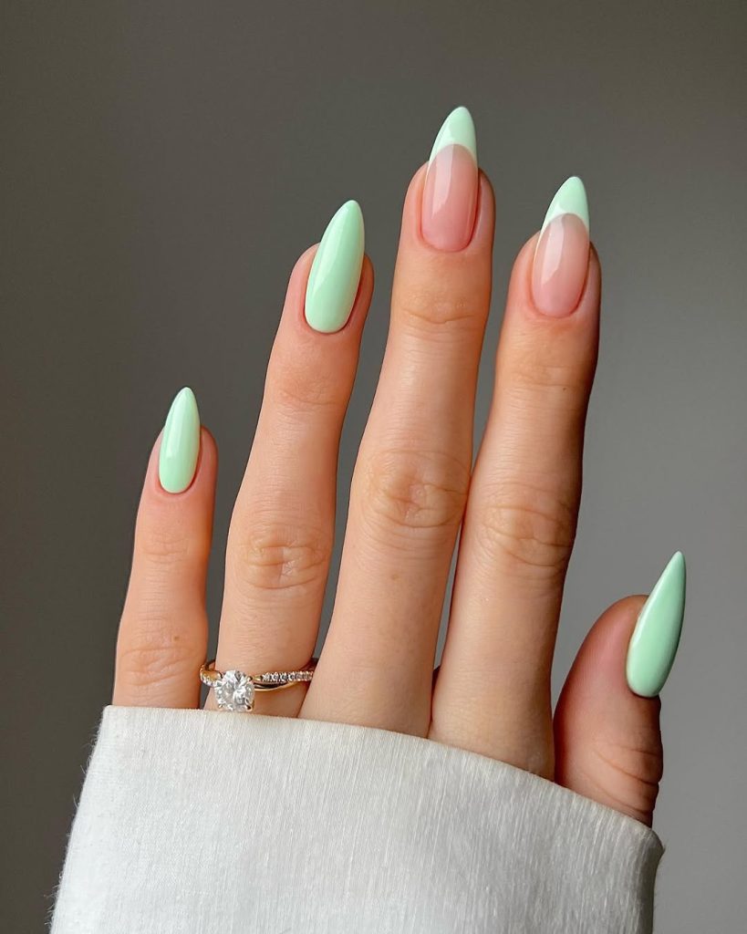 Almond shaped mint green nails with glossy finish
