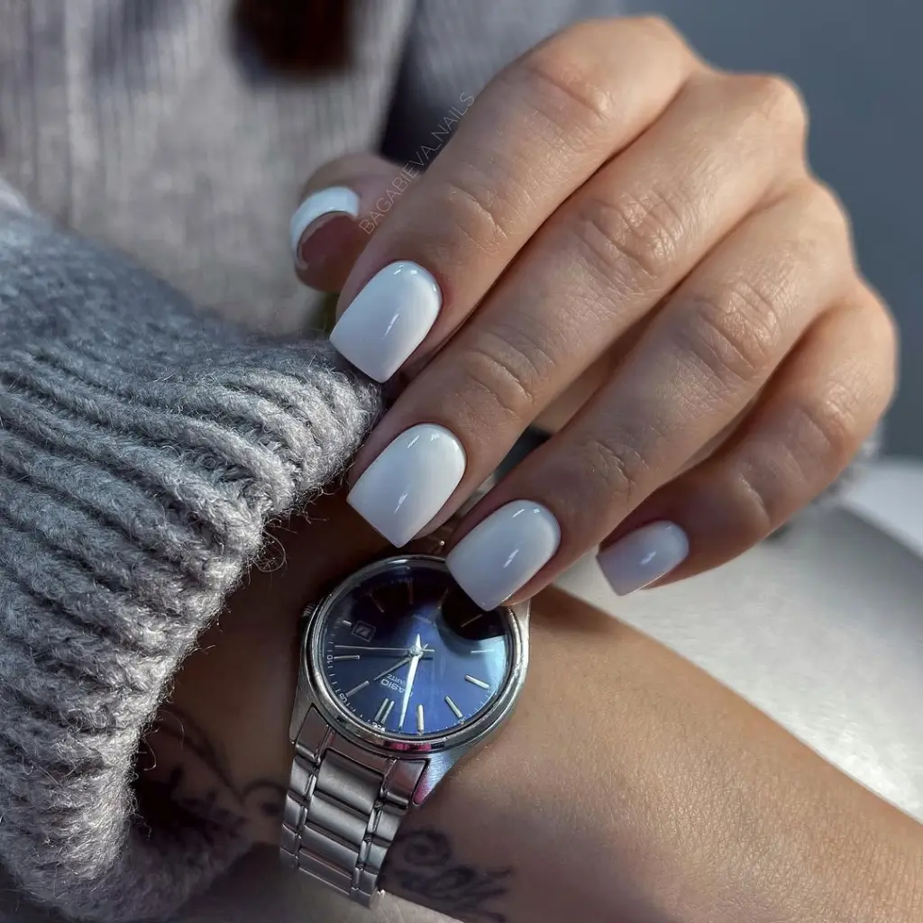Short square bright white nails with glossy finish creating timeless old money elegance perfect for spring