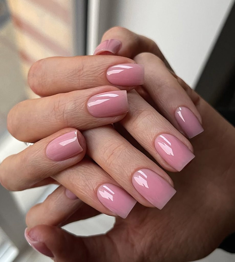 Pink polish on medium square nails