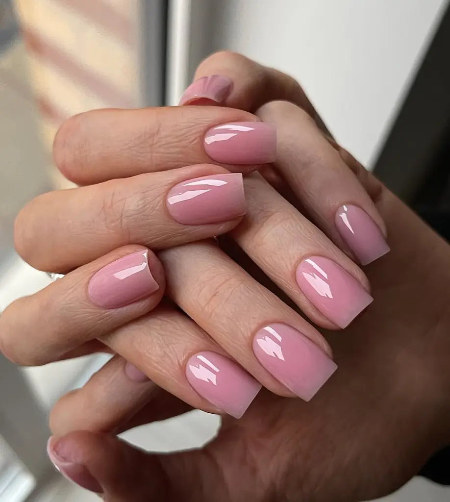 Pink polish on medium square nails