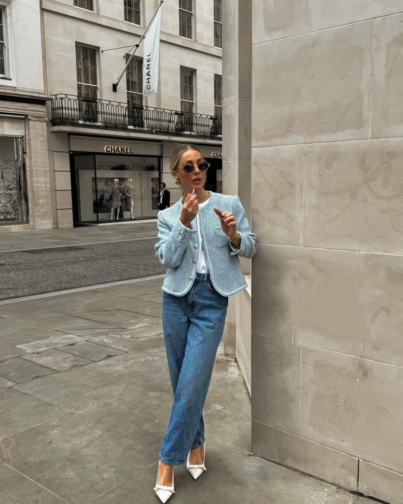 French chic spring outfit with blue tweed jacket, white t-shirt, straight leg jeans and white kitten heels
