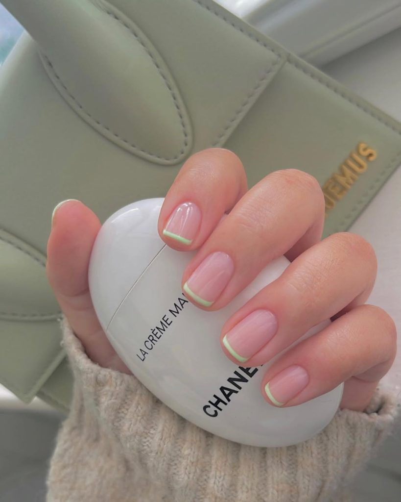 Short square pink nails with delicate mint green micro-French tips embodying refined old money elegance for spring