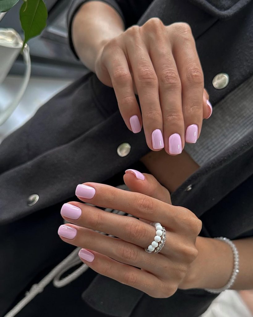 Soft pink polish on short square elegant nails